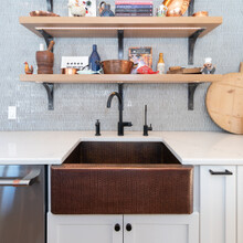 Custom Built Luxury Home in Manchester, VT copper farm style sink with open shelving above